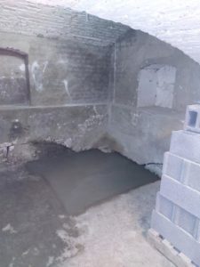 BATI-IDF remise en état de la surface : dallage béton armé fini après les fouilles de reconnaissance — site pénitentiaire de Béthune (62).